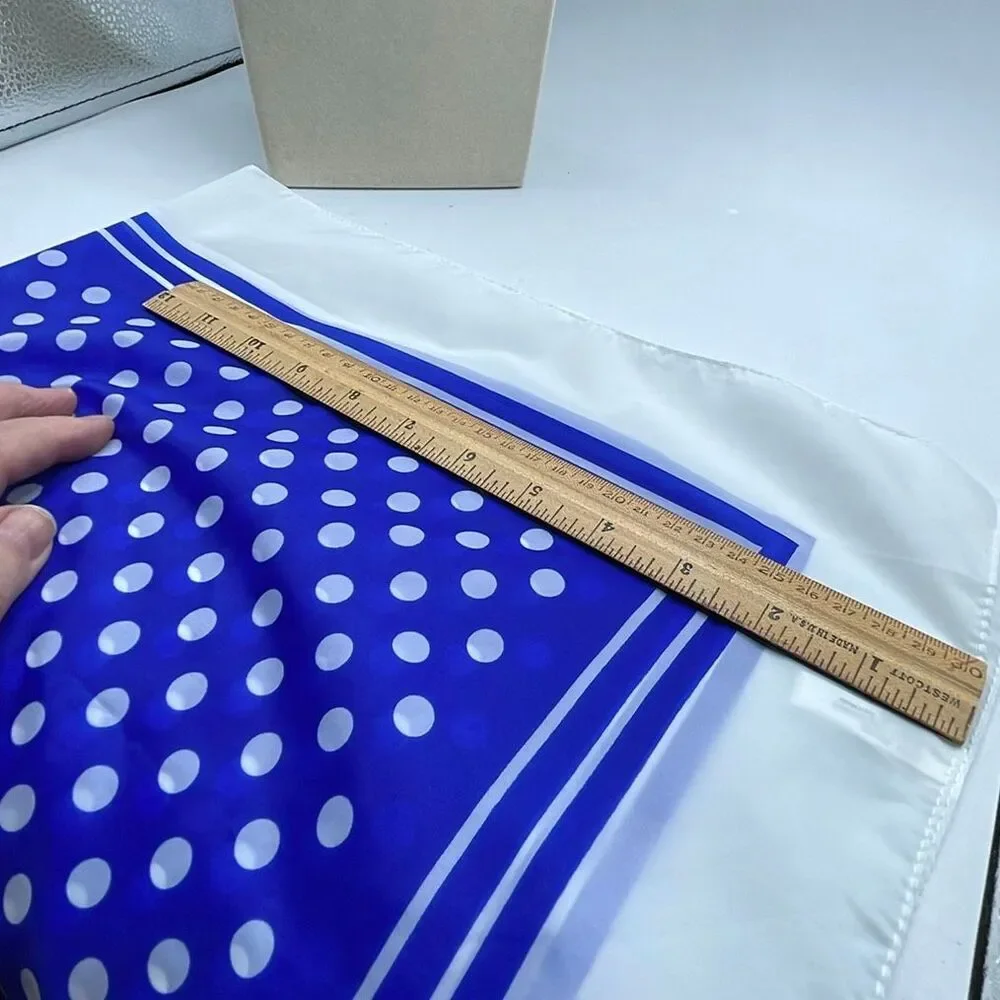 Vintage 26” X27” nylon hand rolled scarf. Water resistant.